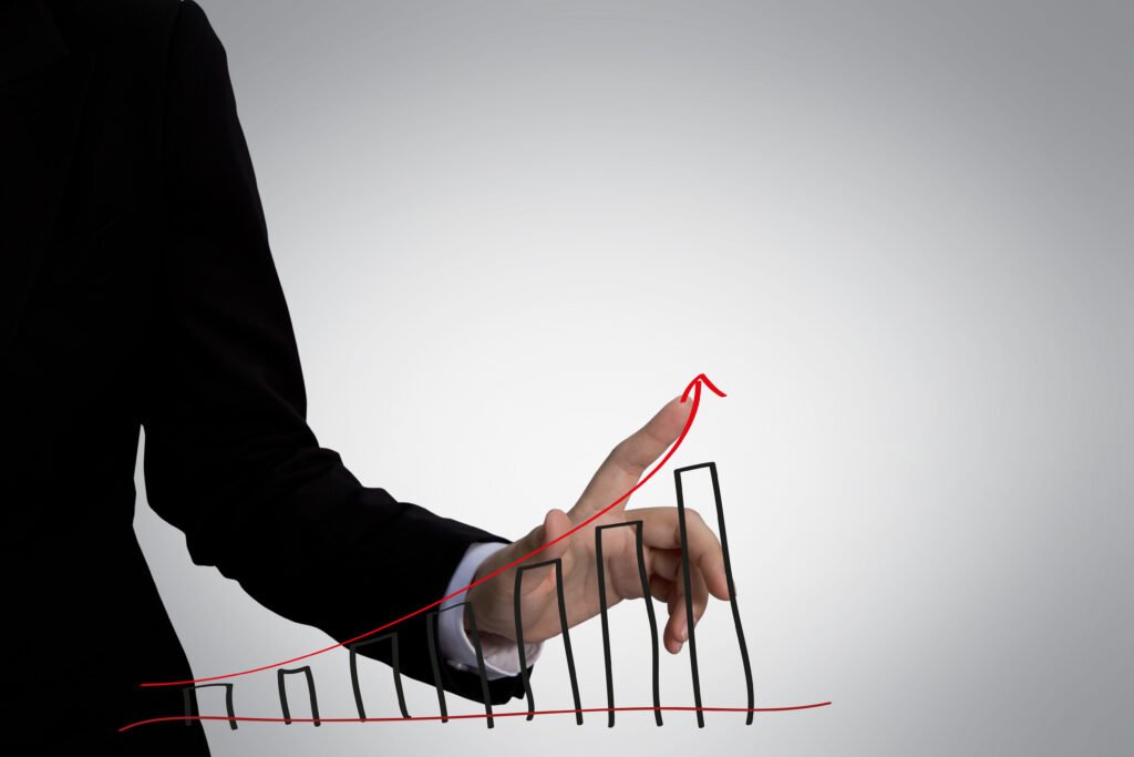 index finger touching graph with red arrow
